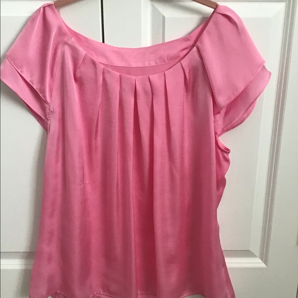 Pink polyester cap sleeved blouse. Washable.